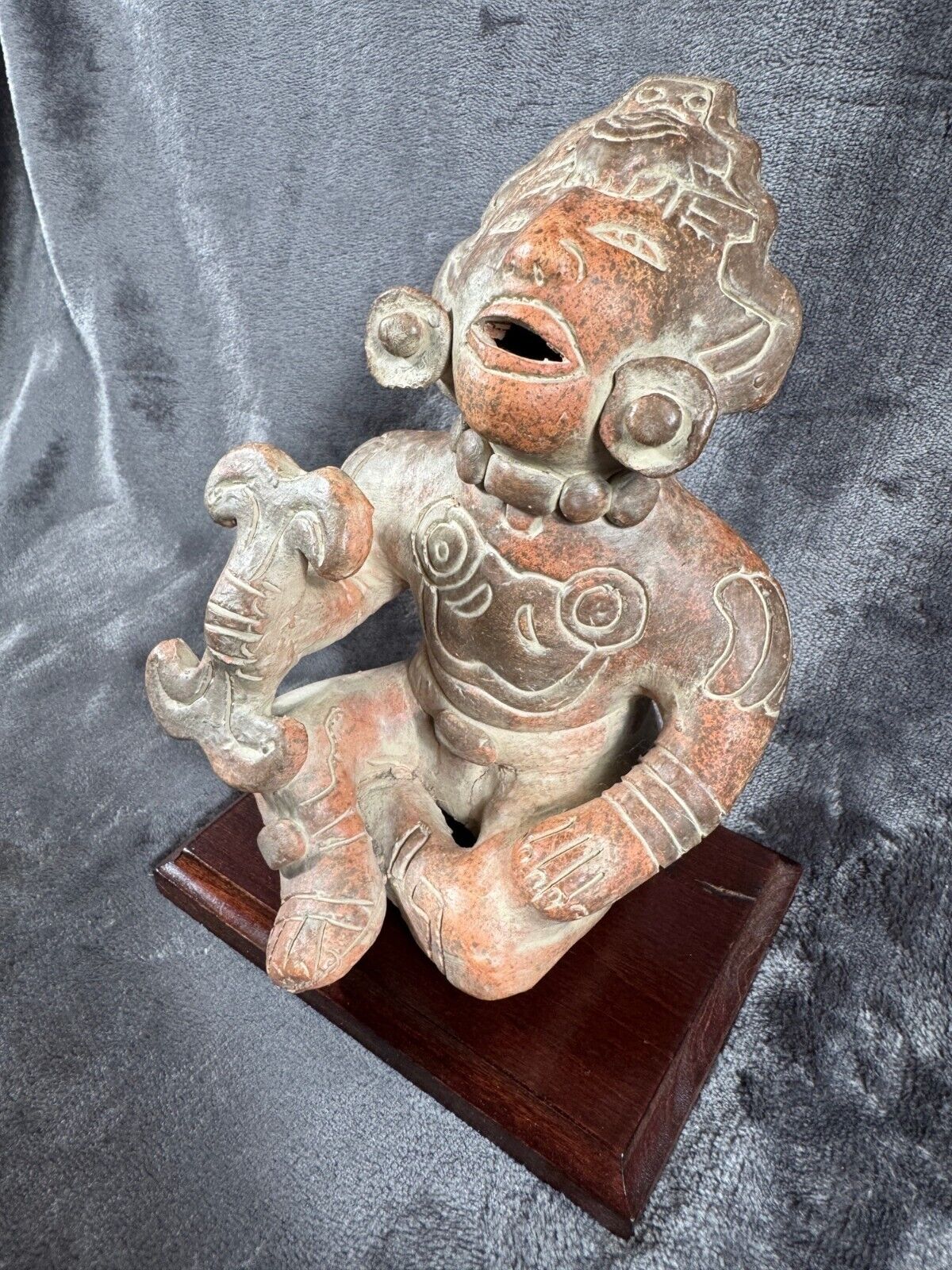 Ancient Clay Warrior Sculpture With Intricate Details On Wooden Base