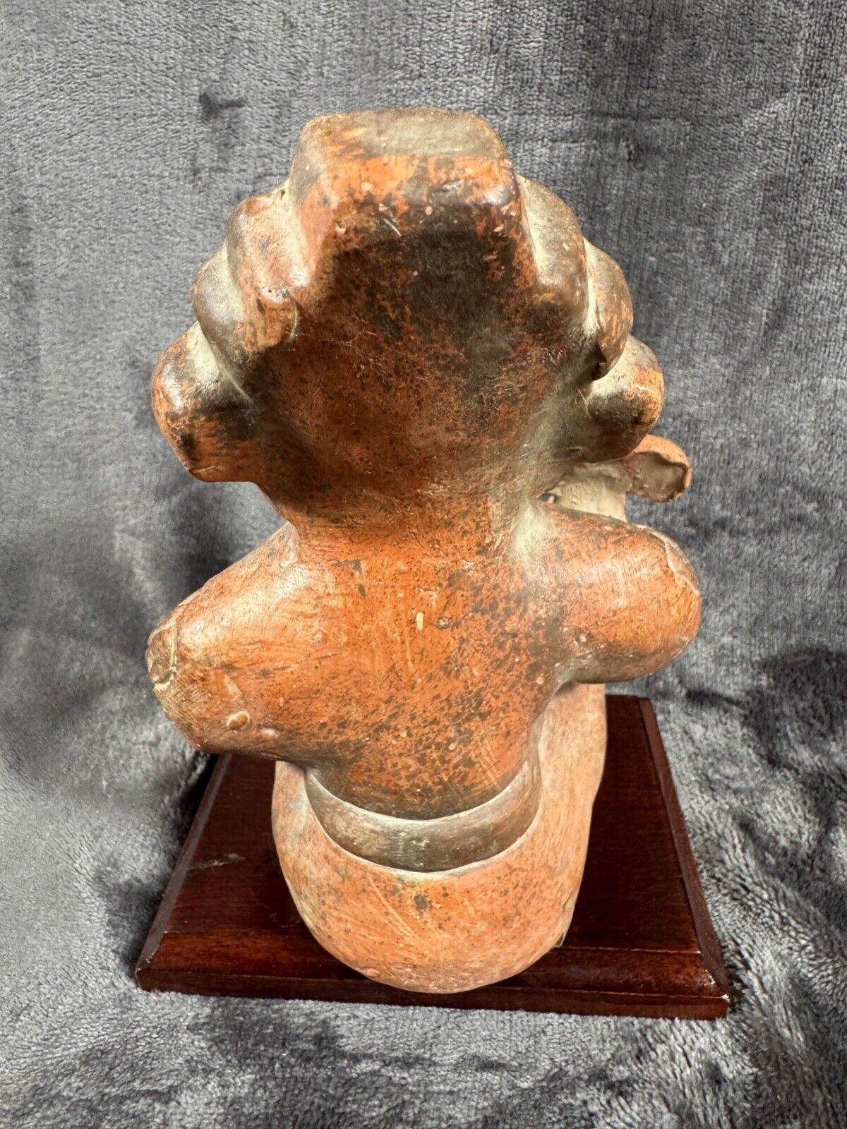 Ancient Clay Warrior Sculpture With Intricate Details On Wooden Base