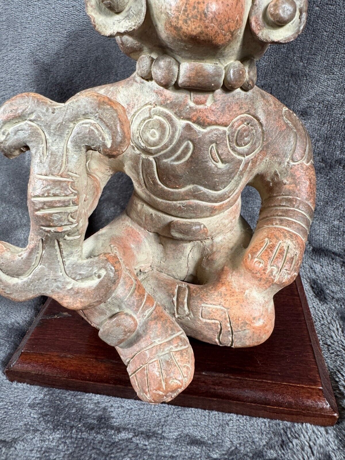 Ancient Clay Warrior Sculpture With Intricate Details On Wooden Base