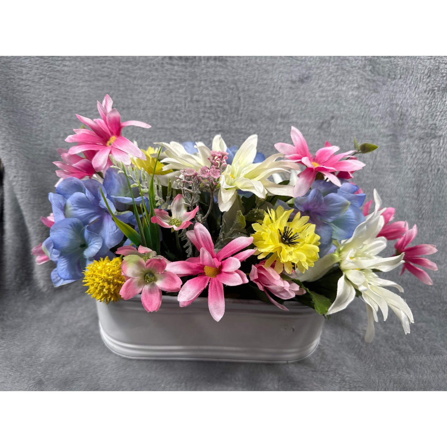 Artificial Floral Arrangement In White Metal Planter With Pink Yellow Blue & White Flowers