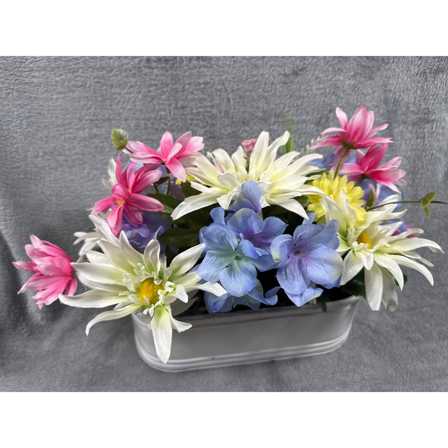 Artificial Floral Arrangement In White Metal Planter With Pink Yellow Blue & White Flowers