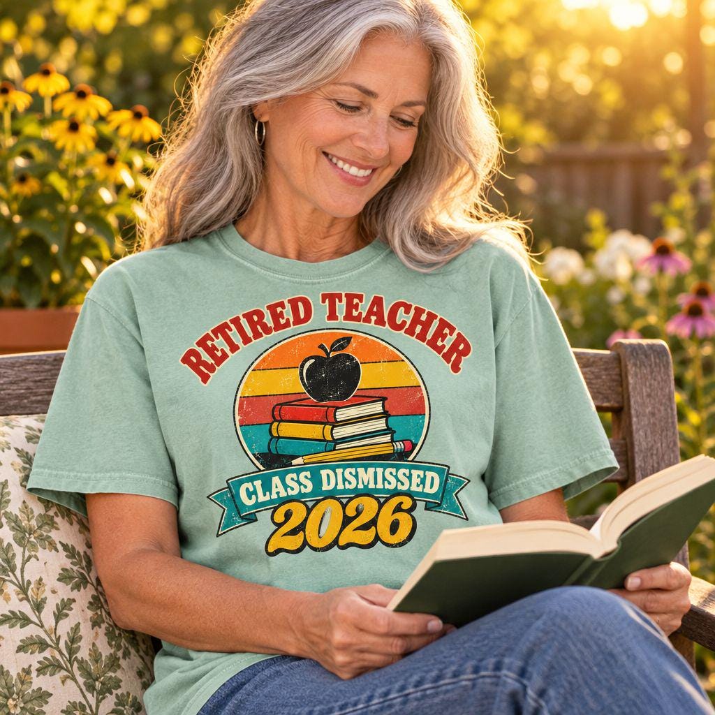 Retired teacher reading on a garden bench wearing a Chalky Mint Retired Teacher 2026 t-shirt