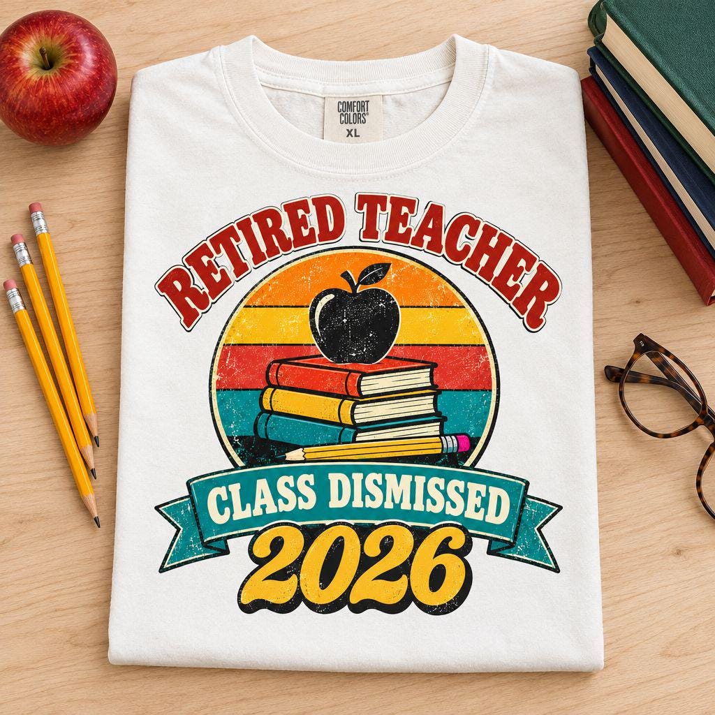 Flat lay of a white Retired Teacher 2026 t-shirt with an apple, books and pencils